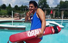 Image oflifeguard smiling pointing